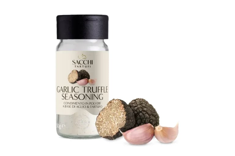Sacchi garlic truffle seasoning jar with fresh truffles, garlic cloves, and salt displayed beside the bottle